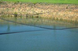 black-net-over-lake-pond-prevents-cormorant-birds-catching-fish-water-areas-near-large-air