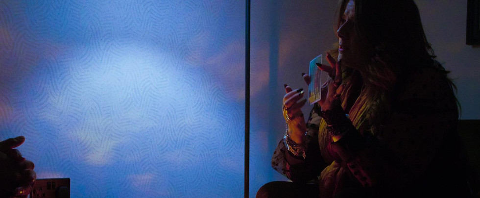 Donna holding 8 of wands