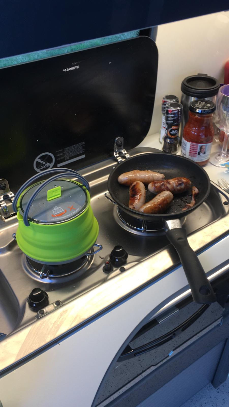 Cooking Sausages in the Campervan