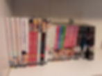 23 Seven Seas manga on a shelf; from L-R: My Androgynous Boyfriend (v.1-3), Love is an Illusion! (v.1), Outbride (v.1-2), I'll NEver Be Your Crown Princess (v.1), Game Between the Suits (v. 1). Ladies on Top (v.1), The Case Files of Jeweler Richard (v.1-2), Who Wants to Marry a Billionaire? (v.1-3), Fire in His Fingertips (v.1-4), Bite Maker (v.1-5)