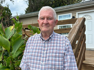 James "Jim"Taylor in front of one of the transitional homes for veterans 