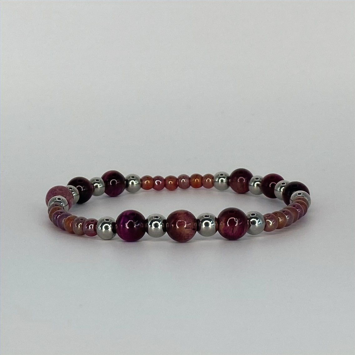 Armband van roze tijgeroog met zilverkleurig rvs