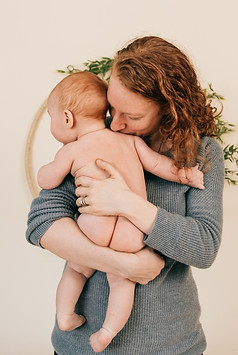 Mother huggin her baby