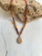 Orange necklace with a sea stone pendant