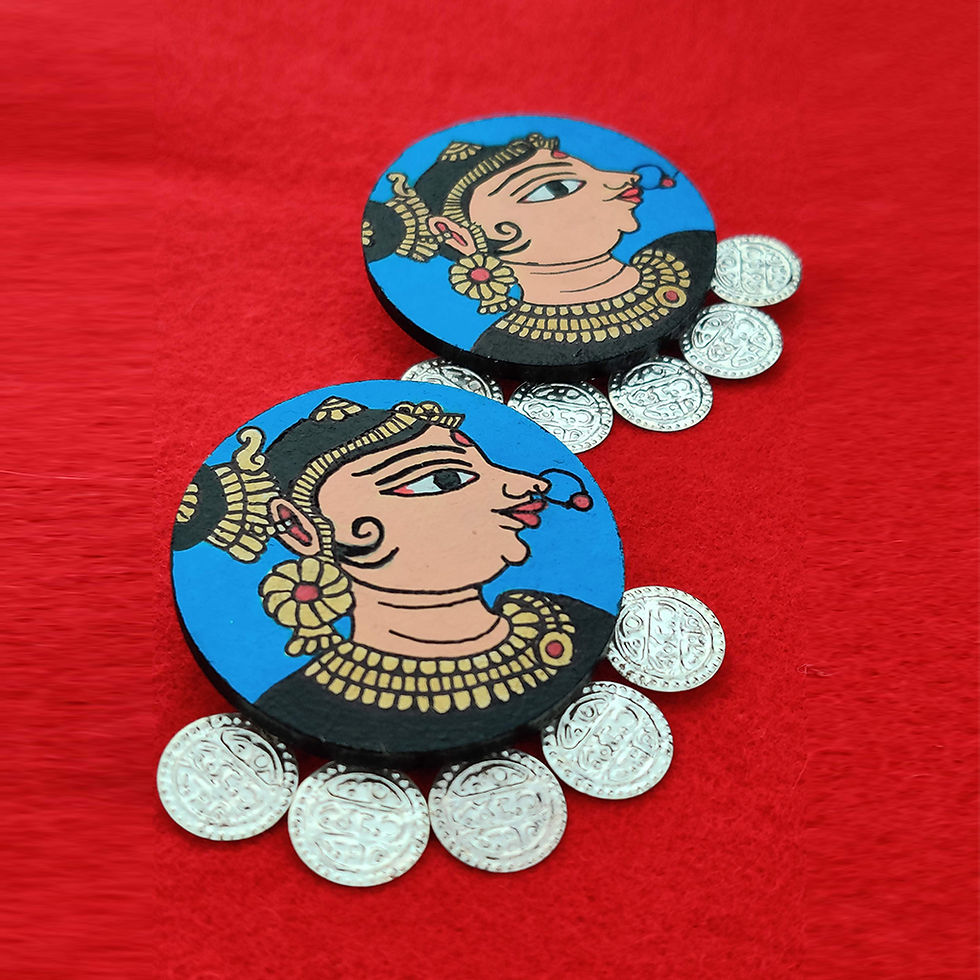 Patachitra hand-painted wooden earrings featuring intricate designs inspired by traditional Indian art.