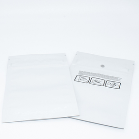 two white mylar plastic pouches with tamper evident tear notches and resealable, child resistant closures for full cannabis packaging compliance