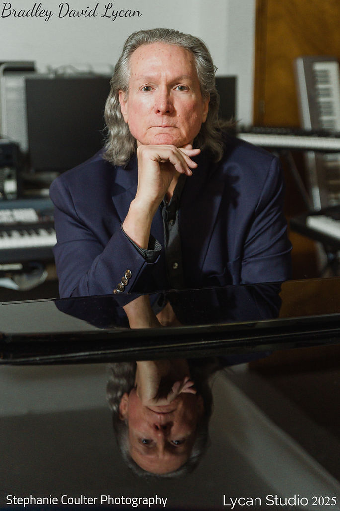 Brad sittng in Studio m2025_edited.jpg