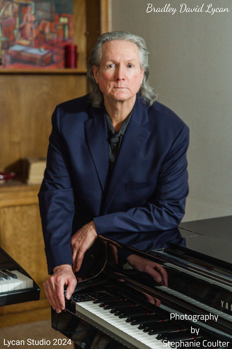 Brad posing at piano Autumn 2024_edited.jpg