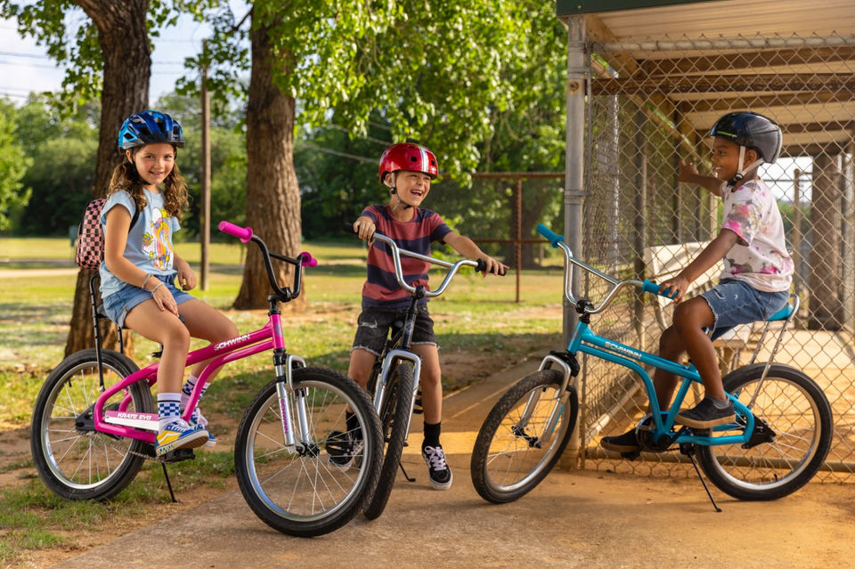 Kids on bike hanging out and laughing photo by award-winning commercial photography Andrew Bennett
