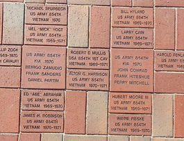 A detailed picture of veterans written into the brick walkway.