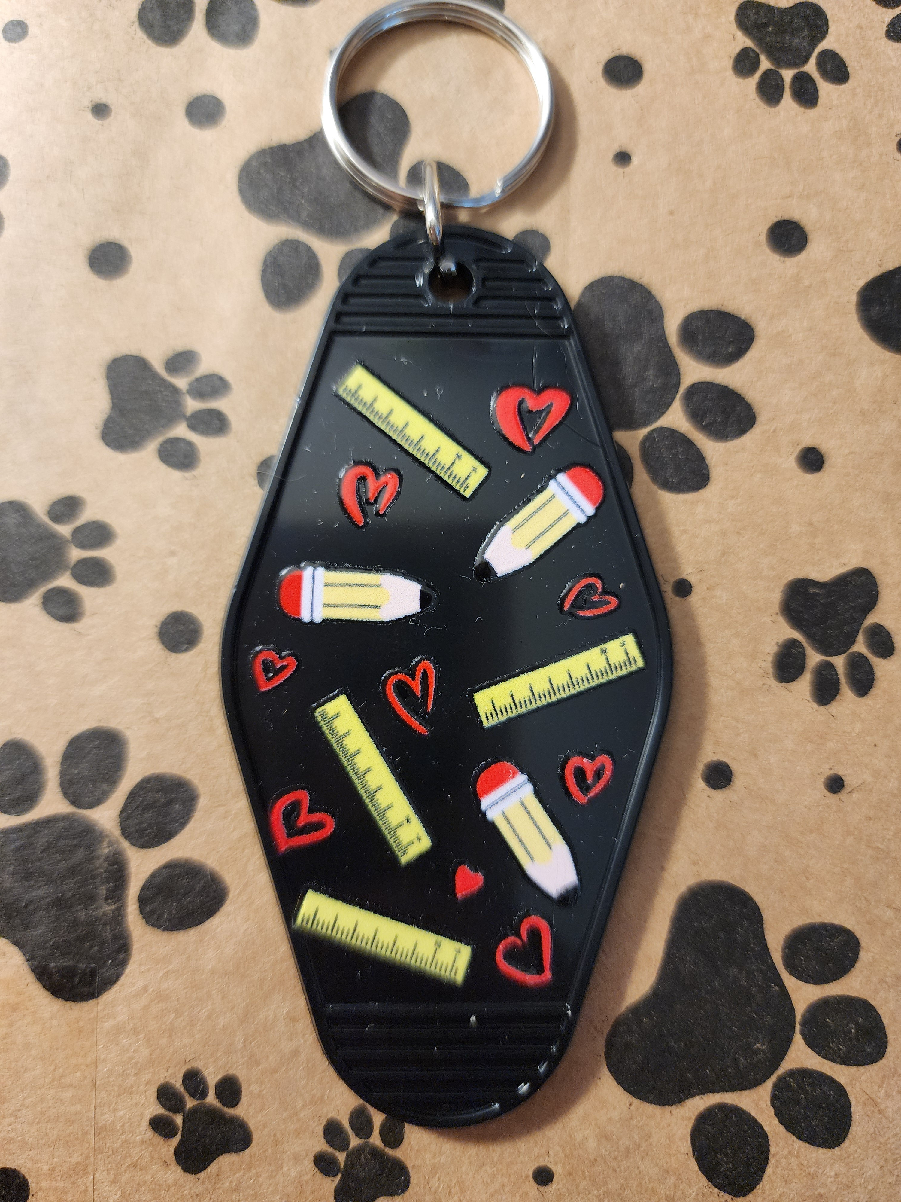 Black Keychain with Pencil and Heart Design