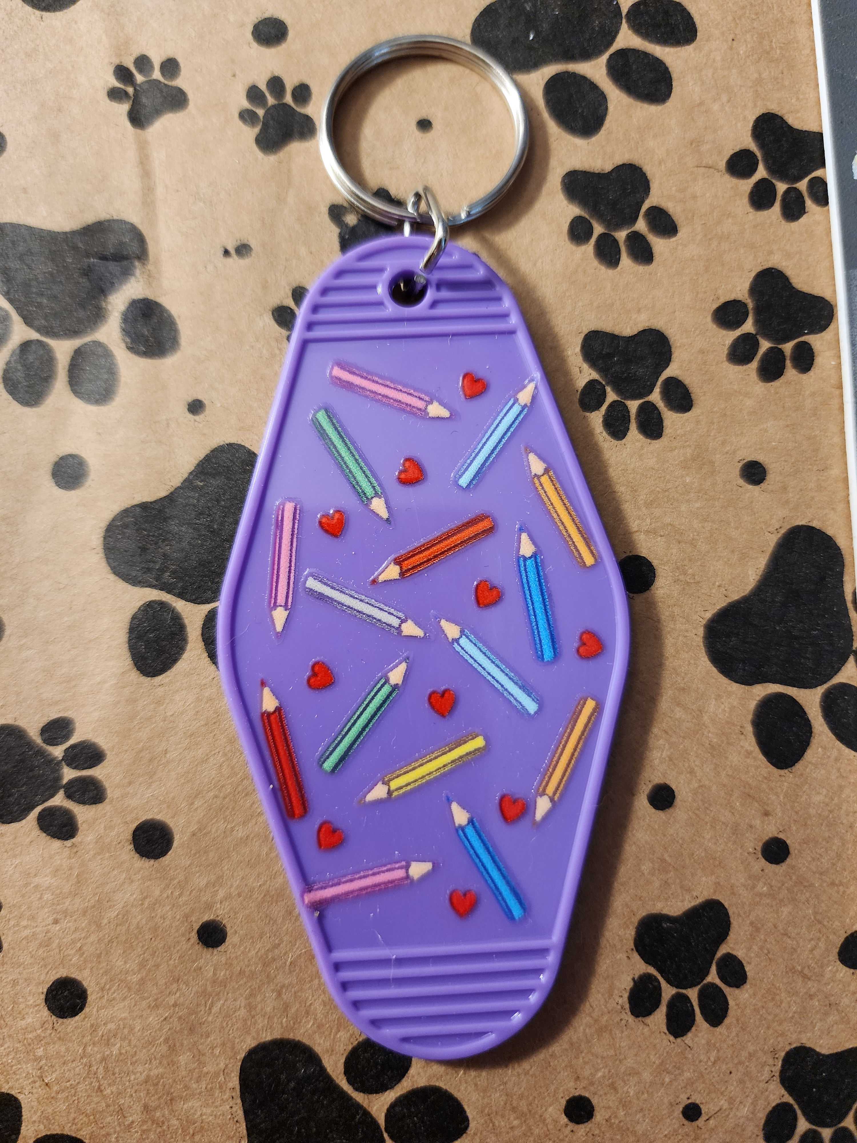 Purple Keychain with Colorful Pencil Design