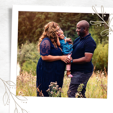 black-husband-wife-and-little-girl-hug-by-creek