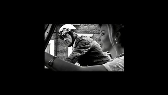 At a red light, a biker on his vintage Norton Commando café racer, runs into a stylish woman in a cabriolet. He revs his engine to impress her, but when the light changes his temperamental British bike stalls, leaving her to speed away.  The pair embark on a wordless, and flirty chase through the city pitting romance against the quirky reliability of their machines in a playful homage to thh café-racer era.

Also of note is Joe Strummer's (The Clash) appearance and soundtrack.