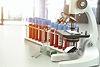 microscope-medical-test-tubes-with-blood-samples-i-2025-03-06-03-09-21-utc.jpg