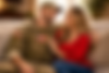 Military couple sharing a joyful moment.png