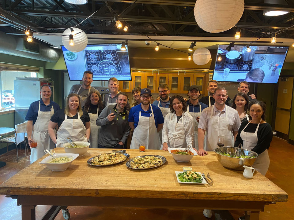 Group photo of team at cooking class