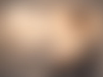 Male psychology applicant sitting thoughtfully in a clinical interview setting, symbolising focused thinking and psychological preparation for DClinPsy selection interviews.