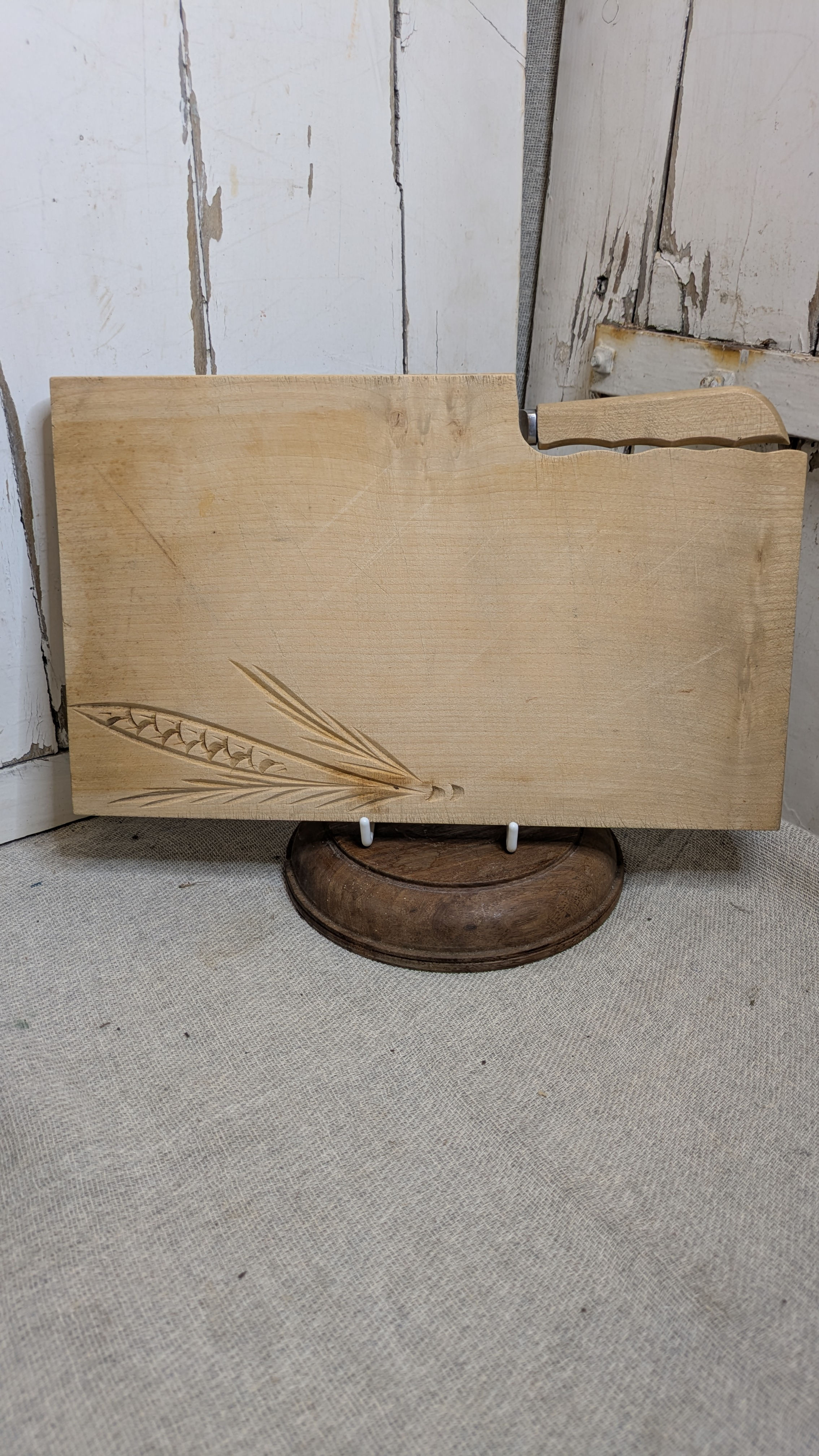 Carved wooden bread board and knife