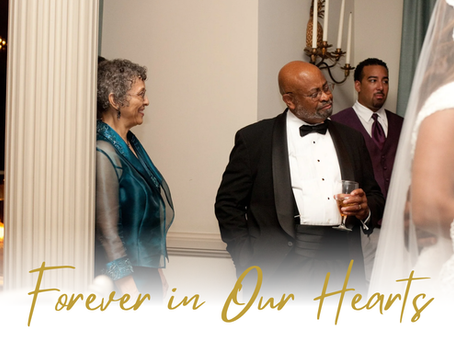Uncle Charles, dressed in a black tuxedo, smiles during a family wedding celebration, surrounded by loved ones.