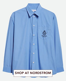 Sporty & Rich blue oversized button-down shirt for a Modern Metropolitan luxury morning edit with designer wardrobe foundations and sharp city styling.