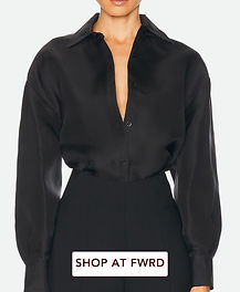 Carolina Herrera black oversized silk button-down blouse with open neckline, dropped shoulders, long sleeves and relaxed evening shirt silhouette.