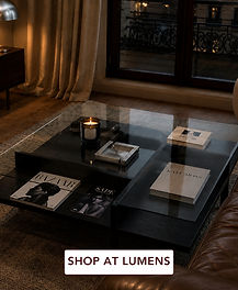BDI Terrace 1150 square coffee table by Matthew Weatherly in charcoal stained wood with a polished glass top and open pinwheel storage compartments, styled in a modern evening living room.