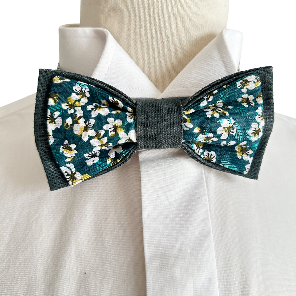 noeud papillon vert et fleurs blanche pour mariage champetre