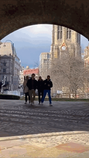 People walking through a city being guided by the My Freedom Tours app