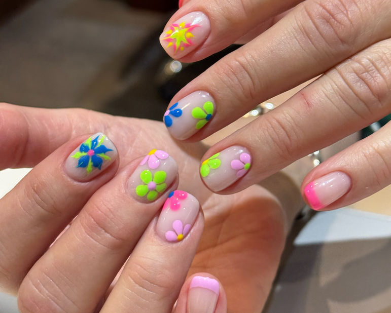 Bright colored daisy flowers nail art manicure