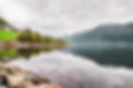 calm-lake-norwegian-national-park-surrounded-with-big-mountains-gloomy-weather.jpg