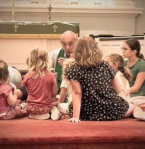 Pastor Erik with Children during Children's Message