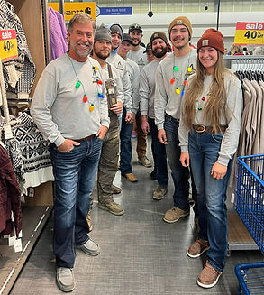Men and Women shopping at Meijer in matching shirts