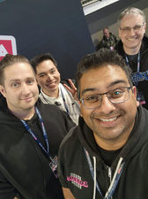 Prof. Rare, Wilson Yip (Card Merchant), Asad Khalid (PokeCollection) & Mike Haught (Sorcery: Contested Realm) on stage at Auckland Card Show. 