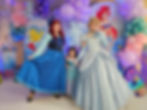 Cinderella and Ariel pose for a pic at a birthday party