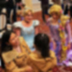 Princesses meet a child at an event