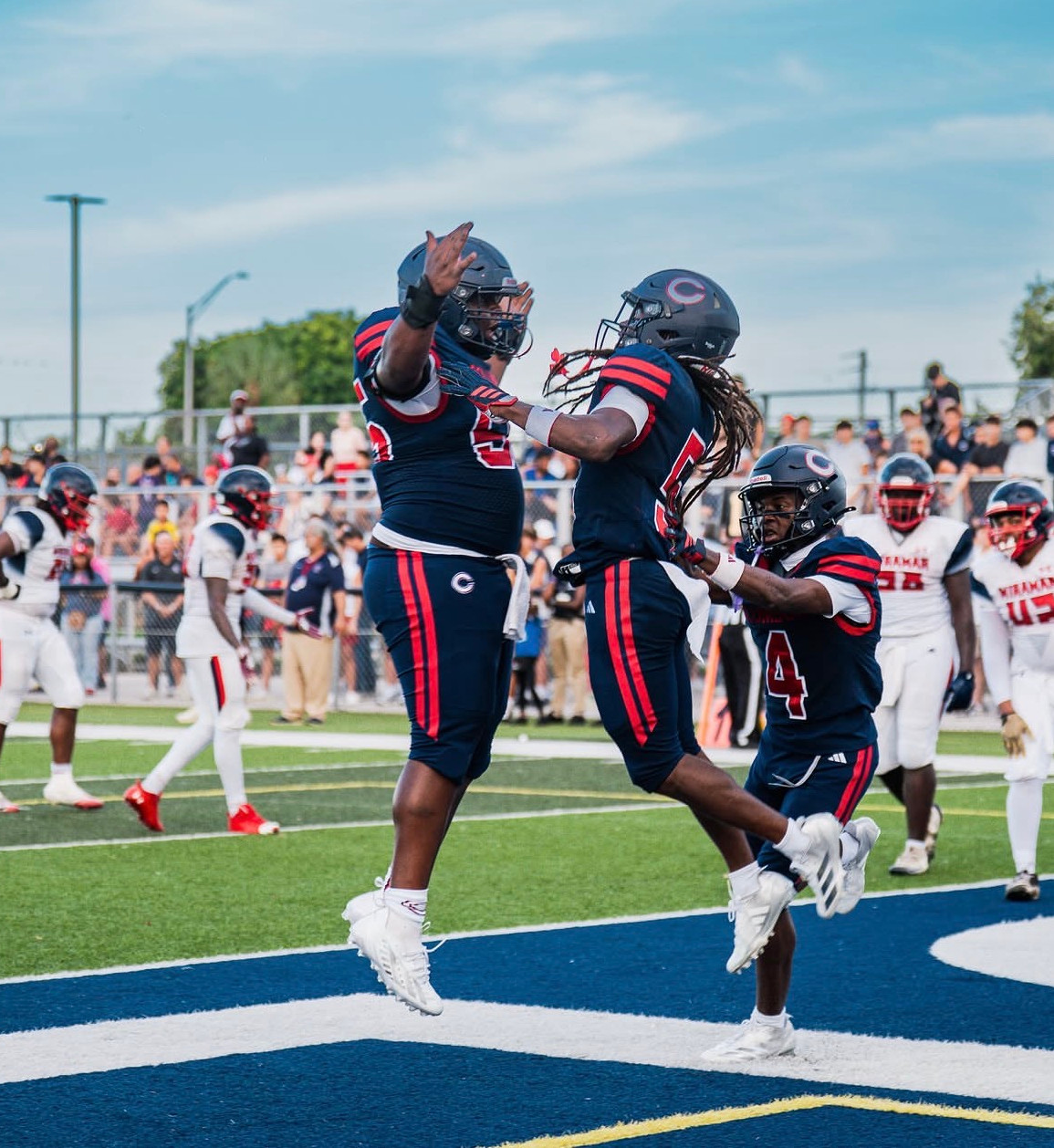 Columbus running back Cecil Smith celebrates his early touchdown. (Photo Credit: @dani.media11)