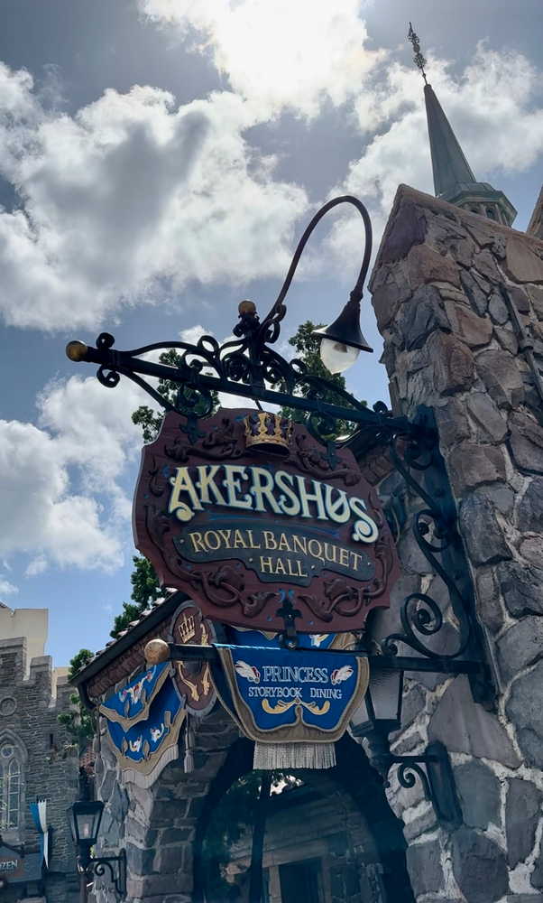 wooden sign on a medieval style building that says Akershus royal banquet