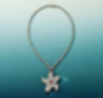 Exceptionally matched unenhanced rubies from Mozambique, Africa, bring a mesmerizing quality to the creations. Round brilliant diamonds layered over rose-cut diamonds, as well as gold tendrils, bring dimension and texture to each piece. One transformable pendant, set with over 3 total carats of these exceedingly rare rubies, can also be worn as a brooch. 