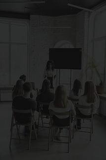 female-african-american-speaker-giving-presentation-hall-university-workshop_edited.jpg
