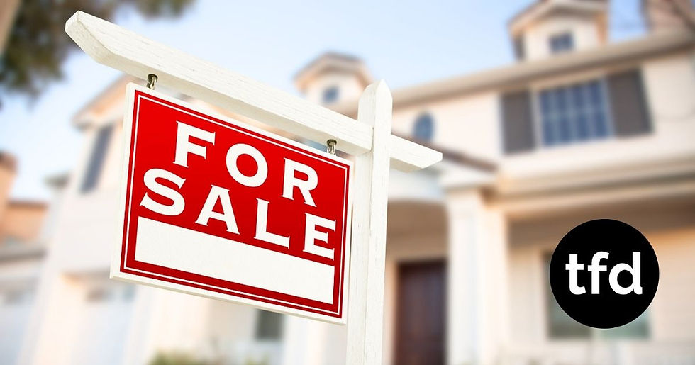 A "FOR SALE" sign in a suburban neighborhood as housing affordability challenges continue to affect American households.
