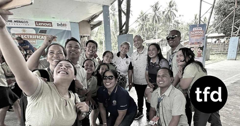 One Meralco Foundation president, Jeffrey O. Tarayao, shares a candid moment with the teachers during a school electrification program. (Photos: One Meralco Foundation)