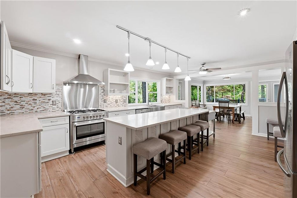 Open-concept kitchen with oversized island and dining area