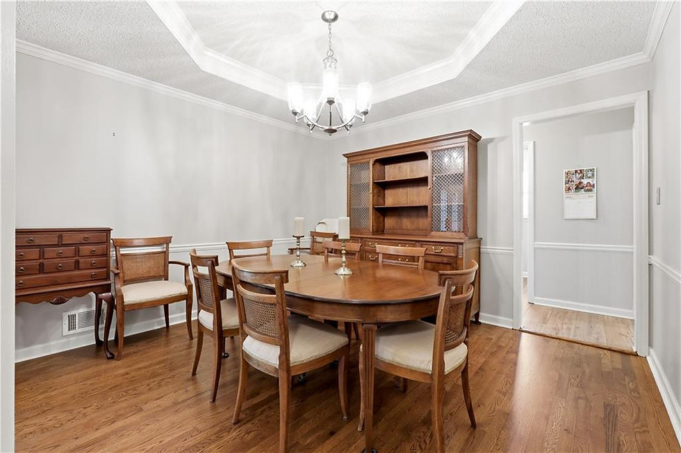 Formal dining room with crown molding and hardwood floors