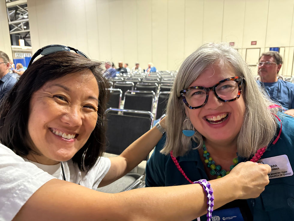 Lori giving a lei to Tara Barber of The Ministerial Excellence, Support & Authorization team.