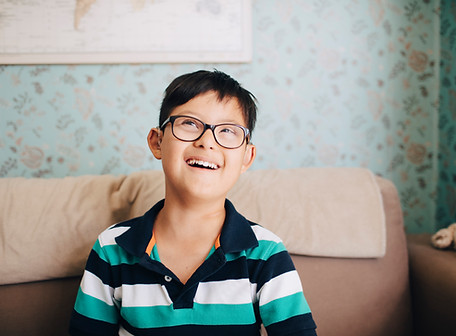 A smiling boy wearing glasses