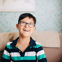 Portrait of a Boy with Glasses