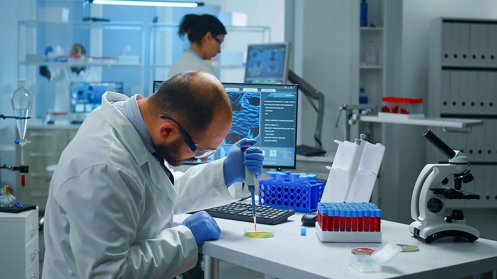 scientist-putting-blood-sample-from-test-tube-with-micropipette-petri-dish-analysing-chemi