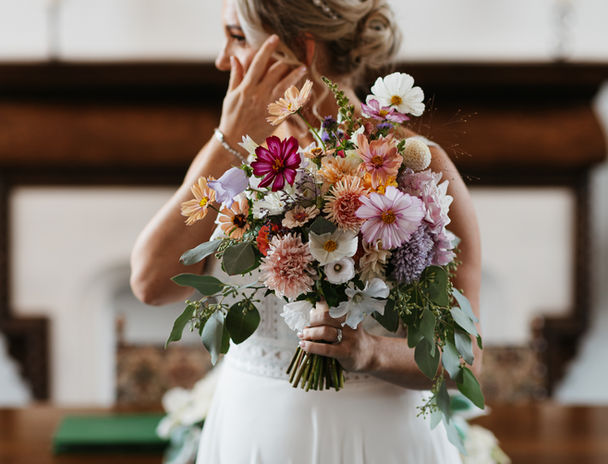 Bride holding colorful wedding bouquet