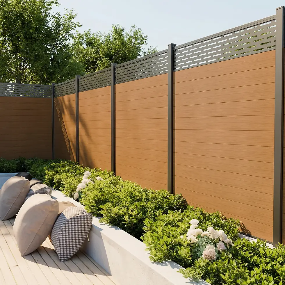 Horizontal wood-look composite fence with decorative top screen in a landscaped backyard